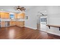 Kitchen features light wood cabinets, stainless steel appliances and hardwood floors at 640 Pacific Ave, Fort Lupton, CO 80621