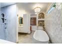 Elegant bathroom with freestanding tub and modern finishes at 6039 W Fair Dr, Littleton, CO 80123