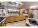 Modern kitchen with updated appliances and cabinetry at 6039 W Fair Dr, Littleton, CO 80123