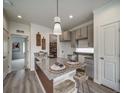 Modern kitchen with granite countertops and stainless steel sink at 13006 E 103Rd Ave, Commerce City, CO 80022