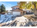 Two-story home with attached two-car garage at 824 W Geddes Cir, Littleton, CO 80120