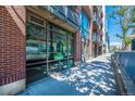 Modern building exterior with large storefront windows and brick facade at 1401 Wewatta St # 101, Denver, CO 80202