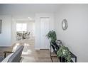 Bright and airy entryway with wood-look floors and stylish decor at 10439 King Cir, Westminster, CO 80031