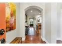 Bright entryway with hardwood floors and art at 6988 S Riverwood Way, Aurora, CO 80016