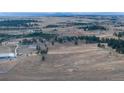 Aerial view of property with large lot and mountain views at 3074 County Road 166, Elizabeth, CO 80107
