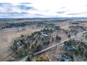 Aerial view of property showing house, outbuildings, and expansive land at 3074 County Road 166, Elizabeth, CO 80107