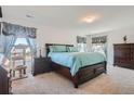 Spacious bedroom with carpeted floors and large windows at 6317 Wescroft Ave, Castle Rock, CO 80104