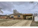 Brick ranch home with a carport and driveway at 9030 Hickory Pl, Thornton, CO 80229