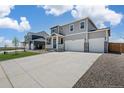 Two-story house with two-car garage and front yard at 4117 Marble Dr, Mead, CO 80504