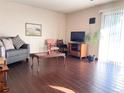 Living room with hardwood floors and ample natural light at 5300 E Cherry Creek South Dr # 116, Denver, CO 80246