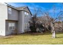 Home's backyard with deck and landscaping at 9362 Autumn Ash Ct, Highlands Ranch, CO 80126