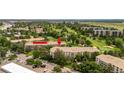 Aerial view of condo building with surrounding golf course at 3144 S Wheeling Way # 209, Aurora, CO 80014
