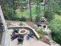 Relaxing patio with fire pit and seating area at 662 Yankakee, Castle Rock, CO 80108