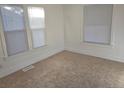 Bright bedroom with neutral carpet and window blinds at 1964 Galena St, Aurora, CO 80010
