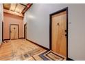 Building hallway with exposed wood beams and hardwood floors at 1792 Wynkoop St # 502, Denver, CO 80202