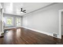 Large living room featuring hardwood floors and a ceiling fan at 3023 E 10Th Ave, Denver, CO 80206