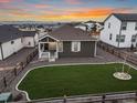 Home with backyard, mountain views, and fenced yard at 12722 Cove St, Firestone, CO 80504