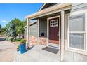 Inviting front porch with stone accents and potted plants at 624 Stuart St, Denver, CO 80204