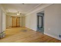 Hardwood floor living room with sliding doors leading to another room at 3333 Colorado Blvd, Denver, CO 80205