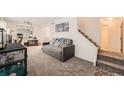 Cozy living room featuring a sleeper sofa and ample space at 3906 S Pitkin Way, Aurora, CO 80013