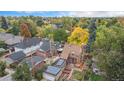 House with a large backyard, solar panels, and garden at 2645 Ash St, Denver, CO 80207