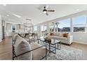 Bright and spacious living room with large windows, hardwood floors, and comfortable furniture at 959 Eldorado Ln, Louisville, CO 80027