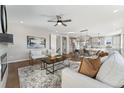 Open concept living room with hardwood floors and a cozy fireplace at 959 Eldorado Ln, Louisville, CO 80027