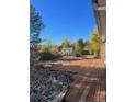 Backyard with a wooden deck and storage shed at 15038 E Greenwood Pl, Aurora, CO 80014