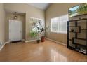Light and airy entryway with hardwood floors and plenty of natural light at 33 Gaviota Ave, Brighton, CO 80601