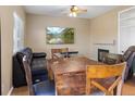 Cozy living room featuring a fireplace and built-in shelving at 33 Gaviota Ave, Brighton, CO 80601