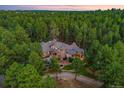 An expansive estate home situated on a private lot in a wooded area at 10231 Democrat Rd, Parker, CO 80134