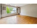 Bright living room with hardwood floors and large windows at 9079 E Nassau Ave, Denver, CO 80237