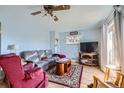 Cozy living room featuring hardwood floors and a sliding glass door at 10762 Blue Jay Ln, Northglenn, CO 80233