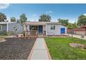 Charming bungalow with landscaped yard and walkway at 7940 Pontiac St, Commerce City, CO 80022