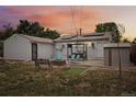 Backyard with firepit, seating area and storage shed at 7940 Pontiac St, Commerce City, CO 80022