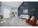 Open living area with bay window, neutral walls, and a comfortable seating area at 44 S Ulster St, Denver, CO 80230