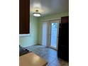 Dining area with tile floor and access to the backyard at 2213 S Kingston Ct, Aurora, CO 80014