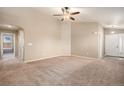 Spacious living room with high ceilings and neutral carpeting at 148 N Irvington St, Aurora, CO 80018