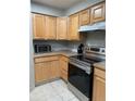 Kitchen with wood cabinets, stainless steel appliances at 14602 E 2Nd Ave # 109C, Aurora, CO 80011
