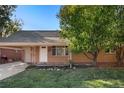Ranch-style brick house with carport at 1575 S Clermont St, Denver, CO 80222