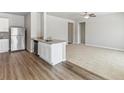 Open concept kitchen and living room at 2144 Alyssa St, Fort Lupton, CO 80621