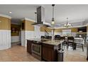 Spacious kitchen with an island, stainless steel appliances, and granite countertops at 28525 Pike View Farm Cir, Elizabeth, CO 80107