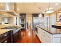 Bright kitchen boasting an island, stainless steel appliances, and a double oven at 5410 Columbine Rd, Denver, CO 80221