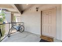 Apartment entryway with bike and welcoming mat at 875 E 78Th Ave # 40, Denver, CO 80229