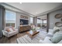 Bright living room with comfy seating and large windows at , Aurora, CO 80019