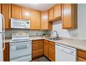 Efficient kitchen with ample cabinetry and appliances at 9385 E Center Ave # 1D, Denver, CO 80247