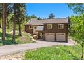 Two-story home with attached two-car garage at 12171 S Critchell Ln, Littleton, CO 80127