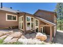 Walkout basement with large windows and stone accents at 12171 S Critchell Ln, Littleton, CO 80127