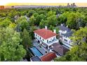 Elegant home with a red tile roof, nestled in a lush, tree-lined neighborhood at 110 N Franklin St, Denver, CO 80218