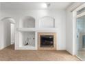 Living room with fireplace and access to other rooms at 3501 E 103Rd Cir # A13, Thornton, CO 80229